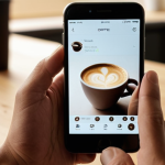 **
    A close-up of a hand effortlessly holding a perfectly ergonomic, minimalist coffee cup, steam gently rising. In the background, subtly blurred, another hand is smoothly interacting with a sleek smartphone, the screen displaying a seamless UI, hinting at integrated fingerprint technology. The scene emphasizes comfort, subtle innovation, and the quiet satisfaction derived from well-designed everyday objects that enhance user experience. Soft, warm morning light streams in, creating a serene and inviting atmosphere. Focus on textures and the natural fit of objects in hand, conveying a sense of quiet revolution in daily life.

2.  **Prompt for